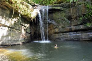 Person swimming in Wanggu Waterfall